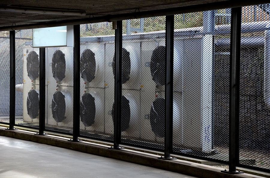 Technician installing a ductless heat pump unit